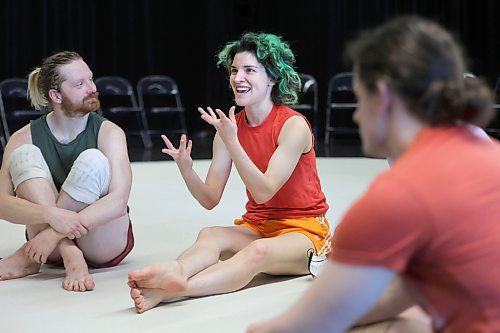RUTH BONNEVILLE / WINNIPEG FREE PRESS 

ENT - WCD

Photo of Winnipeg's Contemporary Dancer Carol-Ann Bohrn (green hair) discussing the final show with fellow dancers before their  rehearsal for their upcoming performance of Returning at WCD studio Thursday. 

Subject: Jolene Bailie, artistic director of Winnipeg's Contemporary Dancers, is closing out the season with a new original work called Retuning. 

Story by Jen Zoratti

April 6th, 2023