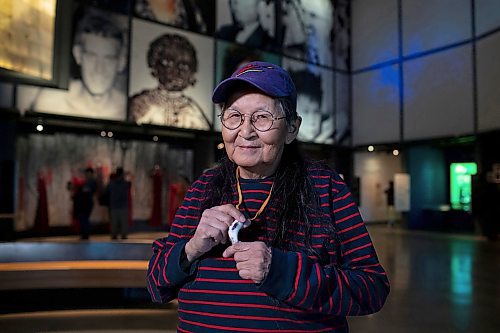 BROOK JONES / WINNIPEG FREE PRESS
Elder Ma-Nee Chacaby, who is holding a bison bone pendant necklace is in Winnipeg for a recording of an oral history interview, which will go towards creating new gallery content for the Canaidan Museum of Human Rights. Chacaby, who is pictued at the CMHR in Winnipeg, Man., Friday, March 21, 2023,  is recognized across Canada as a mentor and advocate for two-spirit communities as she helps build understanding and respect for two-spirit people. 