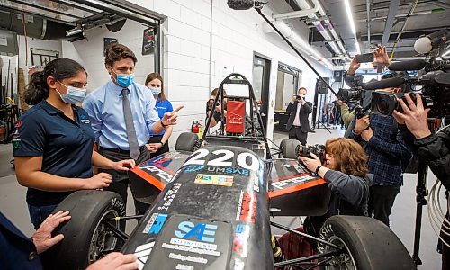 Mike Deal / Winnipeg Free Press
Prime Minister Justin Trudeau chats with engineering students Nivida Mishra (left) and Emma Mctavish (right) while being shown an EV race car that is being built in the Stanley Pauley Engineering Building at the UofM Fort Garry campus Wednesday morning. The PM is in town to announce Budget 2023 measures to help build a clean economy and visit with engineering students at the UofM Wednesday morning.
230412 - Wednesday, April 12, 2023.