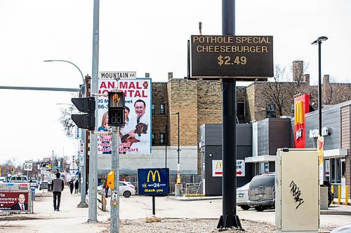 MIKAELA MACKENZIE / WINNIPEG FREE PRESS

A sign at McDonald&#x2019;s on Main Street advertises a &#x201c;pothole special&#x201d; in Winnipeg on Wednesday, April 12, 2023. For Gabby story.

Winnipeg Free Press 2023.