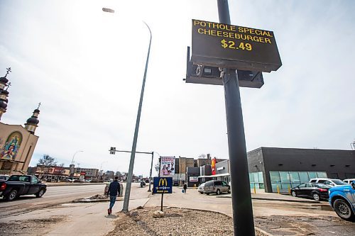 MIKAELA MACKENZIE / WINNIPEG FREE PRESS

A sign at McDonald&#x2019;s on Main Street advertises a &#x201c;pothole special&#x201d; in Winnipeg on Wednesday, April 12, 2023. For Gabby story.

Winnipeg Free Press 2023.