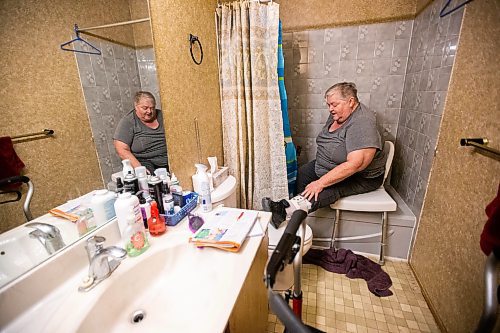 MIKAELA MACKENZIE / WINNIPEG FREE PRESS

Lois Coulson demonstrates the way that she currently has to use the shower (the bathtub makes it very difficult to get in and out with her walker and brace, even with the chair in place) in Winnipeg on Thursday, April 13, 2023. The provincial government recently announced $1.5 million in funding for retrofits like ramps and walk-in showers. For Malak story.

Winnipeg Free Press 2023.