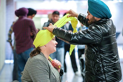 RUTH BONNEVILLE / WINNIPEG FREE PRESS 

STDUP - TURBAN PRIDE DAY

RRC staff member, Judy Braun, has her head wrapped by RRC heavy mechanic student, Lovepreet Singh, on Turban Pride Day at the college on Thursday.  

Red River College Polytechnic community  named, today, April 13th, 2023 as the first official Turban Day in Manitoba during the month of April which is Sikh Heritage Month.  The event  invited anyone at the college to learn about Sikh culture by picking out material and having a member wrap it on their head into a turban that they can wear with pride.   

Sikh Heritage month is now celebrating its fifth year and is a way for students from India to share the importance of the turban with the RRC Polytech community.



April 13th, 2023