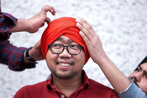 RUTH BONNEVILLE / WINNIPEG FREE PRESS 

STDUP - TURBAN PRIDE DAY

RRC Creative Communications student, Paolo Gonzales, has his head wrapped in a bright red turban on Turban Pride Day at the college on Thursday. 

Red River College Polytechnic community  named, today, April 13th, 2023 as the first official Turban Day in Manitoba during the month of April which is Sikh Heritage Month.  The event  invited anyone at the college to learn about Sikh culture by picking out material and having a member wrap it on their head into a turban that they can wear with pride.   

Sikh Heritage month is now celebrating its fifth year and is a way for students from India to share the importance of the turban with the RRC Polytech community.



April 13th, 2023