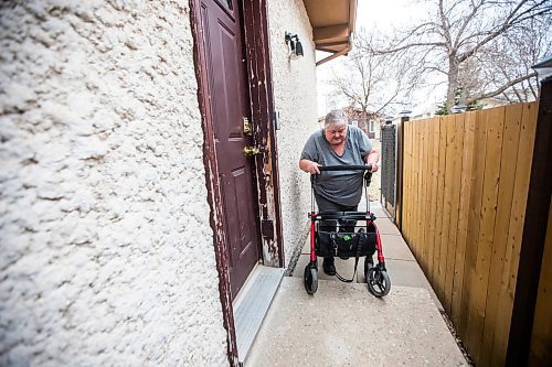 MIKAELA MACKENZIE / WINNIPEG FREE PRESS

Lois Coulson shows how she navigates the difficult step in and out of the main door with her walker (every time she goes up this step she gets pain in her braced knee) in Winnipeg on Thursday, April 13, 2023. The provincial government recently announced $1.5 million in funding for retrofits like ramps and walk-in showers. For Malak story.

Winnipeg Free Press 2023.