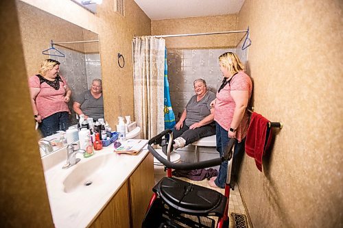 MIKAELA MACKENZIE / WINNIPEG FREE PRESS

Lois Coulson demonstrates the way that she currently has to use the shower (the bathtub makes it very difficult to get in and out with her walker and brace, even with the chair in place) with her daughter, Darcie Luzny, in Winnipeg on Thursday, April 13, 2023. The provincial government recently announced $1.5 million in funding for retrofits like ramps and walk-in showers. For Malak story.

Winnipeg Free Press 2023.