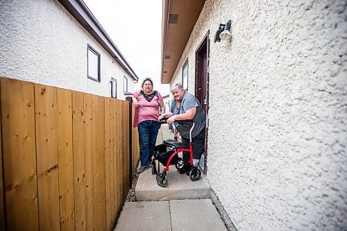 MIKAELA MACKENZIE / WINNIPEG FREE PRESS

Darcie Luzny (left) and her mom Lois Coulson pose for a photo by the troublesome step Lois needs to navigate with her walker to get in and out of the house in Winnipeg on Thursday, April 13, 2023. The provincial government recently announced $1.5 million in funding for retrofits like ramps and walk-in showers. For Malak story.

Winnipeg Free Press 2023.