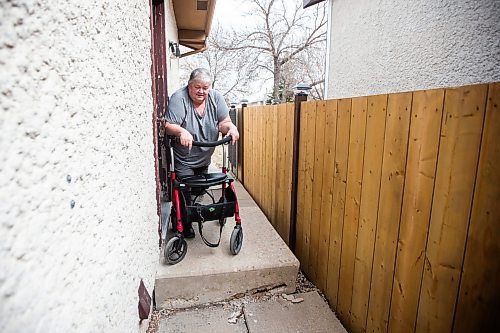 MIKAELA MACKENZIE / WINNIPEG FREE PRESS

Lois Coulson shows the larger step to the back garage (where her mobility scooter is located) that she can&#x574; get past with her walker to access the scooter in Winnipeg on Thursday, April 13, 2023. The provincial government recently announced $1.5 million in funding for retrofits like ramps and walk-in showers. For Malak story.

Winnipeg Free Press 2023.