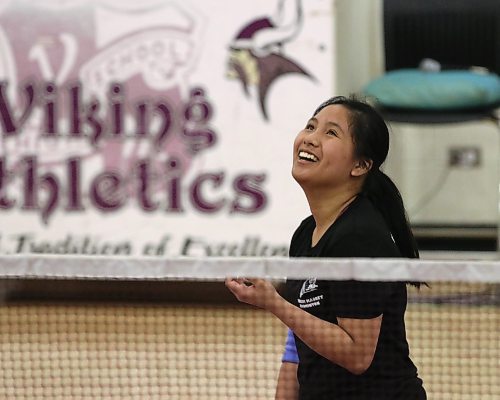 Marie Bartolome smiles between points during a match in the Vincent Massey badminton tournament on Friday at the school. (Perry Bergson/The Brandon Sun)