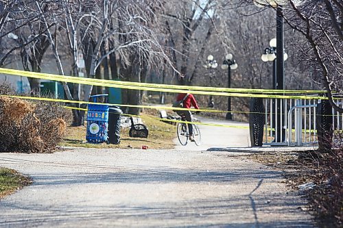 MIKE DEAL / WINNIPEG FREE PRESS
Winnipeg Police unit at a taped off along the Red River at George Street and Waterfront Drive. The taped off area includes a homeless encampment in the bushes of Fort Douglas Park and the river overlook structure. 
230417 - Monday, April 17, 2023