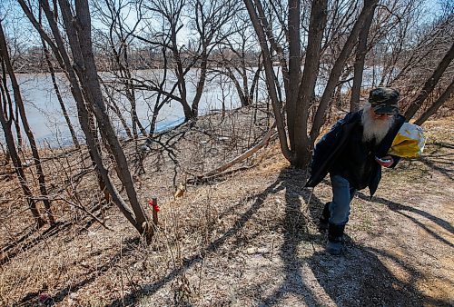 JOHN WOODS / WINNIPEG FREE PRESS
Herman, who found body parts in a bag down by the Red River while out for a walk, walks near the scene Monday, April 17, 2023. 

Re: Kitching