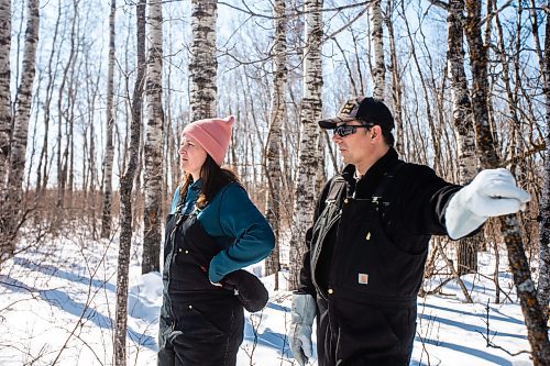 MIKAELA MACKENZIE / WINNIPEG FREE PRESS

Georgina and Josh Mustard traipse through the brush to show where a proposed sand processing site borders their property near Anola on Friday, March 24, 2023. The land has already been clear cut in preparation for the facility. For JS story.

Winnipeg Free Press 2023.