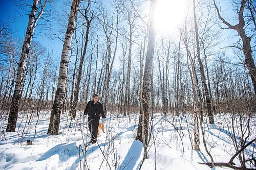 MIKAELA MACKENZIE / WINNIPEG FREE PRESS

Josh Mustard traipses back through the bush after going to look at the proposed sand processing site bordering their property near Anola on Friday, March 24, 2023. For JS story.

Winnipeg Free Press 2023.