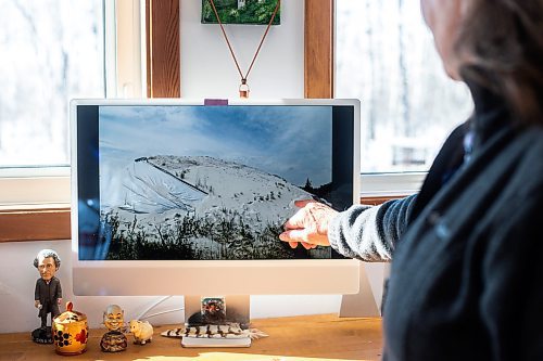 MIKAELA MACKENZIE / WINNIPEG FREE PRESS

Tangi Bell, with Our Line in the Sand, shows photos of uncovered sand piles in Anola on Friday, March 24, 2023. For JS story.

Winnipeg Free Press 2023.