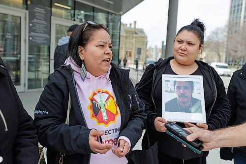 RUTH BONNEVILLE / WINNIPEG FREE PRESS 

Local - Law Courts Sinclair Family 

Stephanie Sinclair (pink),sister to Anthony Sinclair, murder victim of mistaken identity,   taks with reporter as she leaves the Law Courts Building with family members Tuesday. 

April 18th, 2023