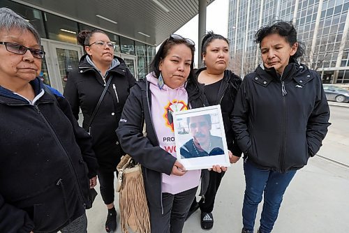 RUTH BONNEVILLE / WINNIPEG FREE PRESS 

Local - Law Courts Sinclair Family 

Stephanie Sinclair (pink),sister to Anthony Sinclair, murder victim of mistaken identity,   taks with reporter as she leaves the Law Courts Building with family members Tuesday. 

Names of other family members in photo:
Left to right
Bernadette Thomas (sister)
Cheryl Sinclair (sister)
Stephanie Sinclair (pink, sister)
Ashley Chomik (Right of Stephanie, mother of one of Anthony's 6 children)
Theresa Sinclair (far right, mom of Anthony)


April 18th, 2023