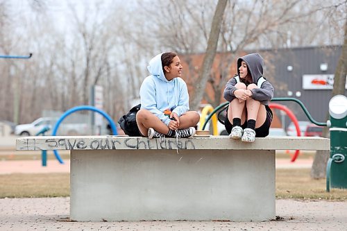 18042023
Friends Genesis Lopez and Zandria Conley visit together at Kin Park in Brandon on a grey and cool Tuesday. 
(Tim Smith/The Brandon Sun)