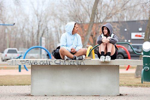 18042023
Friends Genesis Lopez and Zandria Conley visit together at Kin Park in Brandon on a grey and cool Tuesday. 
(Tim Smith/The Brandon Sun)