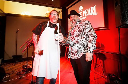JOHN WOODS / WINNIPEG FREE PRESS
Sean McKay, left, and Chris Graves, owner, right, perform a champagne sabering at the soft opening of the Friskee Pearl, a new seafood restaurant opening in the former Earl&#x573; Main Street location, Tuesday, April 18, 2023. 

Re: Wasney