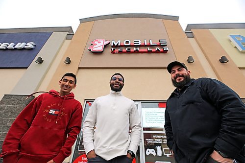 Mobile Tech Labs co-founders Kyle Jagassar (left) and Daniel Okagbare (centre) and operations manager Gilles Laurin stand in front of their new Brandon location at the Corral Centre, the company's second outside of Winnipeg. (Colin Slark/The Brandon Sun)