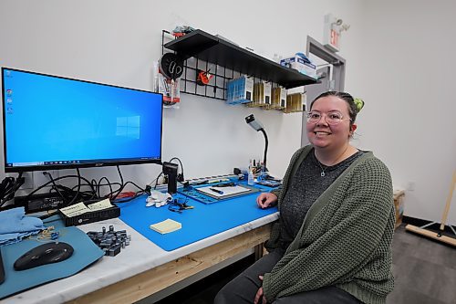 Mobile Tech Labs advanced electronics technician Kelly Paddock shows off her repair station at the company's recently opened Brandon location on Wednesday. (Colin Slark/The Brandon Sun)