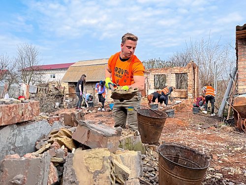 MELISSA MARTIN / WINNIPEG FREE PRESS

University of Manitoba student William Lazarenko, 22, clears rubble from the ruins of Nataliya Sheynich&#x2019;s home, which was partly destroyed last year during battles in the Kyiv region. Lazarenko was volunteering with Brave to Rebuild, a Ukrainian NGO. 
April 2023