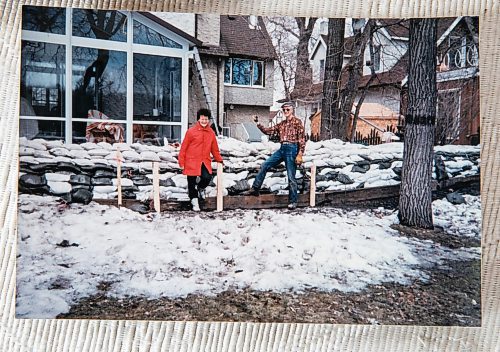 JESSICA LEE / WINNIPEG FREE PRESS

Personal photos of Diana McIntosh are photographed on April 19, 2023. Diana and her husband Grant are photographed putting sand bags in front of their house to protect it from the great flood of 1997.

Reporter: Chris Kitching
