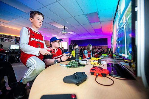 MIKAELA MACKENZIE / WINNIPEG FREE PRESS

Team Sapphire members Ayden Stone (left), Julian Trudel, Ryder Mustard, and Tia Rowan play a game in a tournament in the cole Dugald School (DS) Dragons Esports Lab in Dugald on Wednesday, April 19, 2023. Schools are prioritizing esports and investing in facilities to facilitate learning through online gaming. For Maggie story.

Winnipeg Free Press 2023.