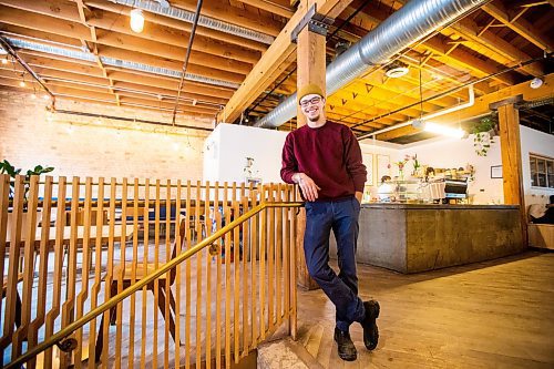 MIKAELA MACKENZIE / WINNIPEG FREE PRESS

Dylan Pereira, owner of Vertical Adventures, poses for a photo in their new location (which is a coffee shop, bar, and soon-to-be climbing space) in the Exchange District in Winnipeg on Thursday, April 20, 2023. For Gabby story.

Winnipeg Free Press 2023.