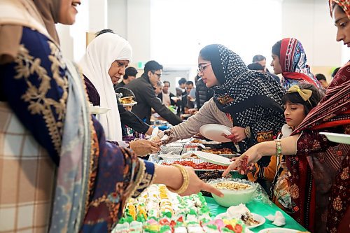 Members of Manitoba’s Muslim community celebrate and feast together at the Provincial Exhibition of Manitoba Display Building No. II in Brandon during Eid al-Fitr (festival of breaking the fast). (Tim Smith/The Brandon Sun)