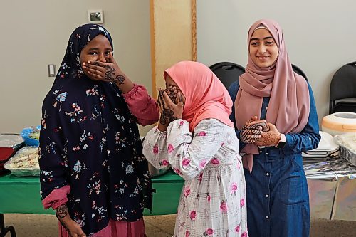 Ferdowsa Abdullahi, Sabrin Abdullahi and Mariam Masri visit together at an Eid al-Fitr celebration in Brandon on Friday. (Tim Smith/The Brandon Sun)