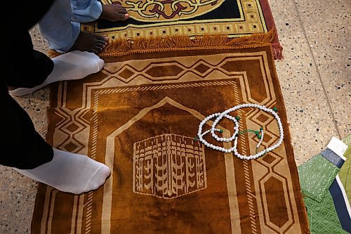 Prayers beads rest on a prayer rug at an Eid al-Fitr celebration in Brandon on Friday. (Tim Smith/The Brandon Sun)