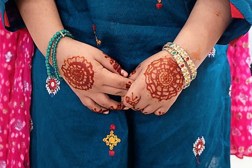 Haniya Al Ahdal, 8, wears intricate henna tattooing on her hands at an Eid al-Fitr celebration in Brandon on Friday. (Tim Smith/The Brandon Sun)