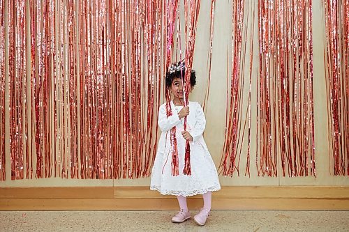 Jummana Wahab, 3, plays with colourful decorations at an Eid al-Fitr celebration in Brandon on Friday. (Tim Smith/The Brandon Sun)