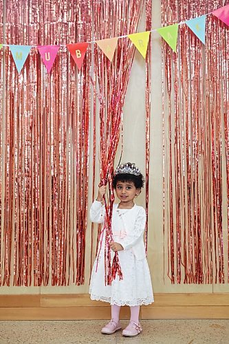 Jummana Wahab, 3, plays with colourful decorations at an Eid al-Fitr celebration in Brandon on Friday. (Tim Smith/The Brandon Sun)