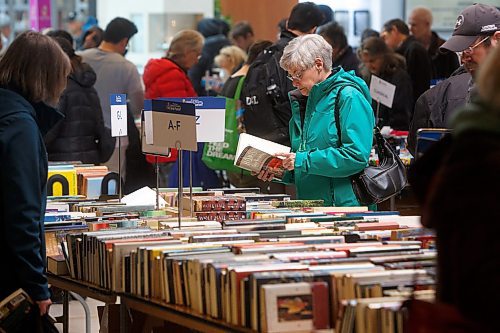 Mike Deal / Winnipeg Free Press
Clarice Matthews browses the books to stock up the cottage for the summer.
Children&#x2019;s Hospital Book Market at St. Vital Centre, Friday afternoon. The market will be open again Saturday, April 22, 2023, where thousands of donated used books can be purchased with proceeds going towards the Children&#x2019;s Hospital.
230421 - Friday, April 21, 2023.