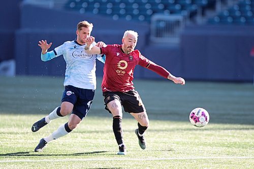 BROOK JONES / WINNIPEG FREE PRESS
Valour FC played to a 1-1 draw against Athl&#xe9;tico Ottawa at IG Field in Winnipeg, Man., Saturday, April 22, 2023. Pictured: Valour FC attacker Anothony Joseph Novak (right) fights for the soccer ball during first half action. 