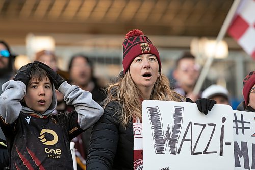 BROOK JONES / WINNIPEG FREE PRESS
L-R: Valour FC fans Pola Imaz and Bauti Imaz react to a play while cheering on the home team at IG field in Winnipeg, Man., Saturday, April 22, 2023. Valour FC played to a 1-1 draw against Athl&#xe9;tico Ottawa. 