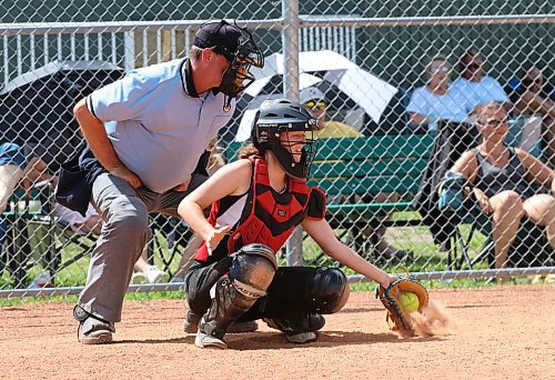 Softball umpire-in-chief Bruce Leubke watches a low pitch at a game at the Ashley Neufeld Softball Complex last summer. He wishes there were a few more umpires in the massive area he serves. (Perry Bergson/The Brandon Sun)