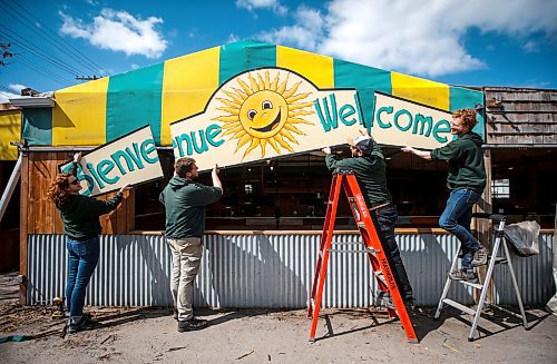 JOHN WOODS / WINNIPEG FREE PRESS
Janelle, from left, Luc, Daniel and Colin Rémillard, owners of St-Léon Gardens, prepare their signage for their seasonal spring opening at their garden store on St Maryճ Rd Tuesday, April 25, 2023. 

Re: standup