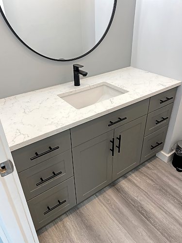 Photos by Marc LaBossiere / Winnipeg Free Press
A custom vanity was ordered to fill the non-standard 52.5-inch cavity inset, topped with a quartz countertop and new sink. 
 