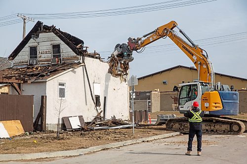 Mike Deal / Winnipeg Free Press
The house at 792 Logan Avenue is being demolished after the second fire there in the past six months.
WFPS crews were sent to the vacant two-storey house around 12:30 a.m. Wednesday. 
230426 - Wednesday, April 26, 2023.