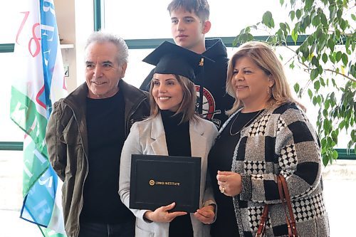 LINKS Institute student Connie Grande poses for a group photo after receiving her mental wellness and harm reduction worker diploma during Thursday's graduation ceremony at the Riverbank Discovery Centre. (Kyle Darbyson/The Brandon Sun)