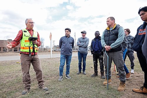 Mario Machado, a surveyor with Dillon Consulting, talks to second-year civil technology program students from Assiniboine Community College about new surveying tech including drones during a field trip to the Daly Overpass replacement project on Thursday. (Tim Smith/The Brandon Sun)