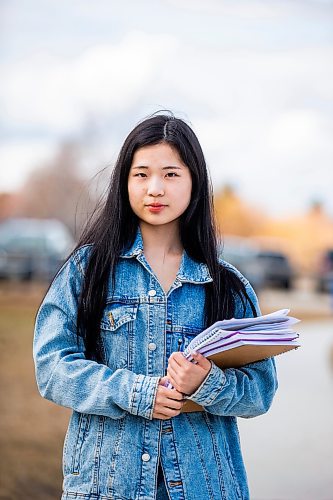 MIKAELA MACKENZIE / WINNIPEG FREE PRESS
Bonnie Chen, a grade 12 student, poses for a photo at J. H. Bruns Collegiate in Winnipeg on Thursday, April 27, 2023. This week, Manitoba Education released more details about the rollout of its new assessment schedule. Chen says exam weeks are a necessary evil that she feels she missed out on and, as a result, she is nervous about attending UBC next year. For Maggie story.
Winnipeg Free Press 2023.