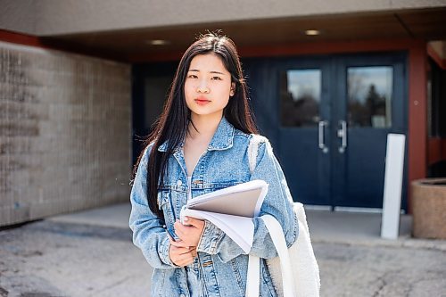 MIKAELA MACKENZIE / WINNIPEG FREE PRESS
Bonnie Chen, a grade 12 student, poses for a photo at J. H. Bruns Collegiate in Winnipeg on Thursday, April 27, 2023. This week, Manitoba Education released more details about the rollout of its new assessment schedule. Chen says exam weeks are a necessary evil that she feels she missed out on and, as a result, she is nervous about attending UBC next year. For Maggie story.
Winnipeg Free Press 2023.