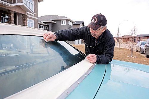 27042023
Norm Poersch polishes his 1965 Pontiac Parisienne at his home in Brandon. (Tim Smith/The Brandon Sun)