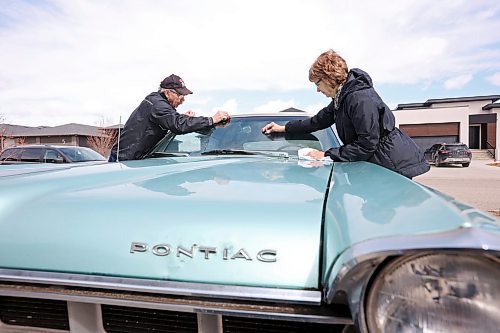 27042023
Norm and Val Poersch polish their 1965 Pontiac Parisienne at their home in Brandon. (Tim Smith/The Brandon Sun)