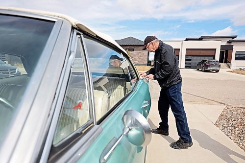 27042023
Norm Poersch polishes his 1965 Pontiac Parisienne at his home in Brandon. (Tim Smith/The Brandon Sun)