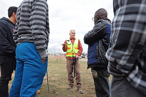 27042023
Mario Machado, a surveyor with Dillon Consulting, talks to second year Civil Technology program students from Assiniboine Community College about new surveying technology including the use of drones during a field trip by the class to the Daly Overpass replacement project on Thursday.  (Tim Smith/The Brandon Sun)